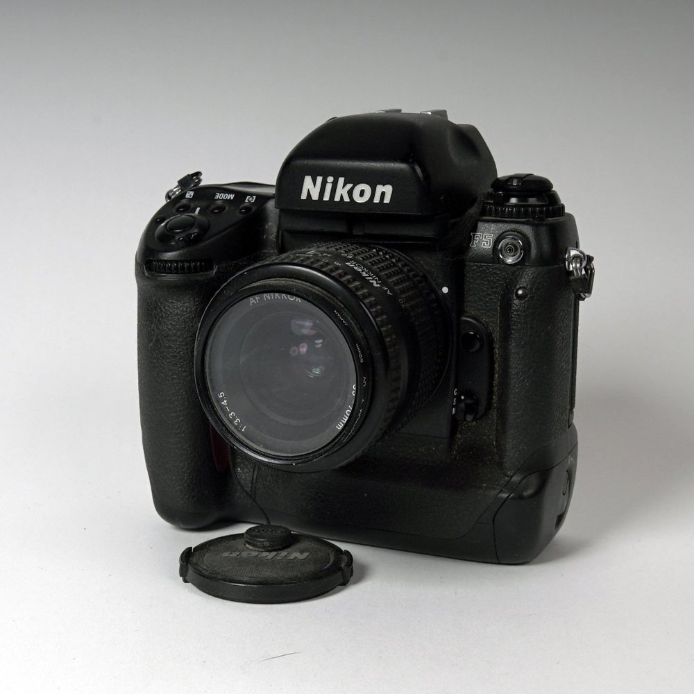 35mm Nikon F5 camera with lens